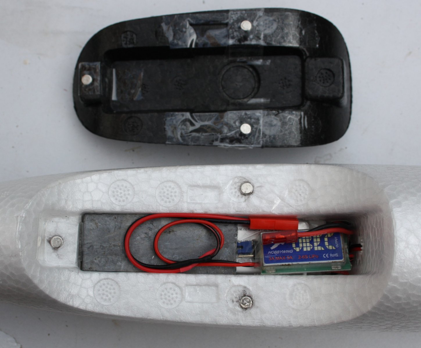 Cockpit with balls, lead, battery and UBEC.JPG